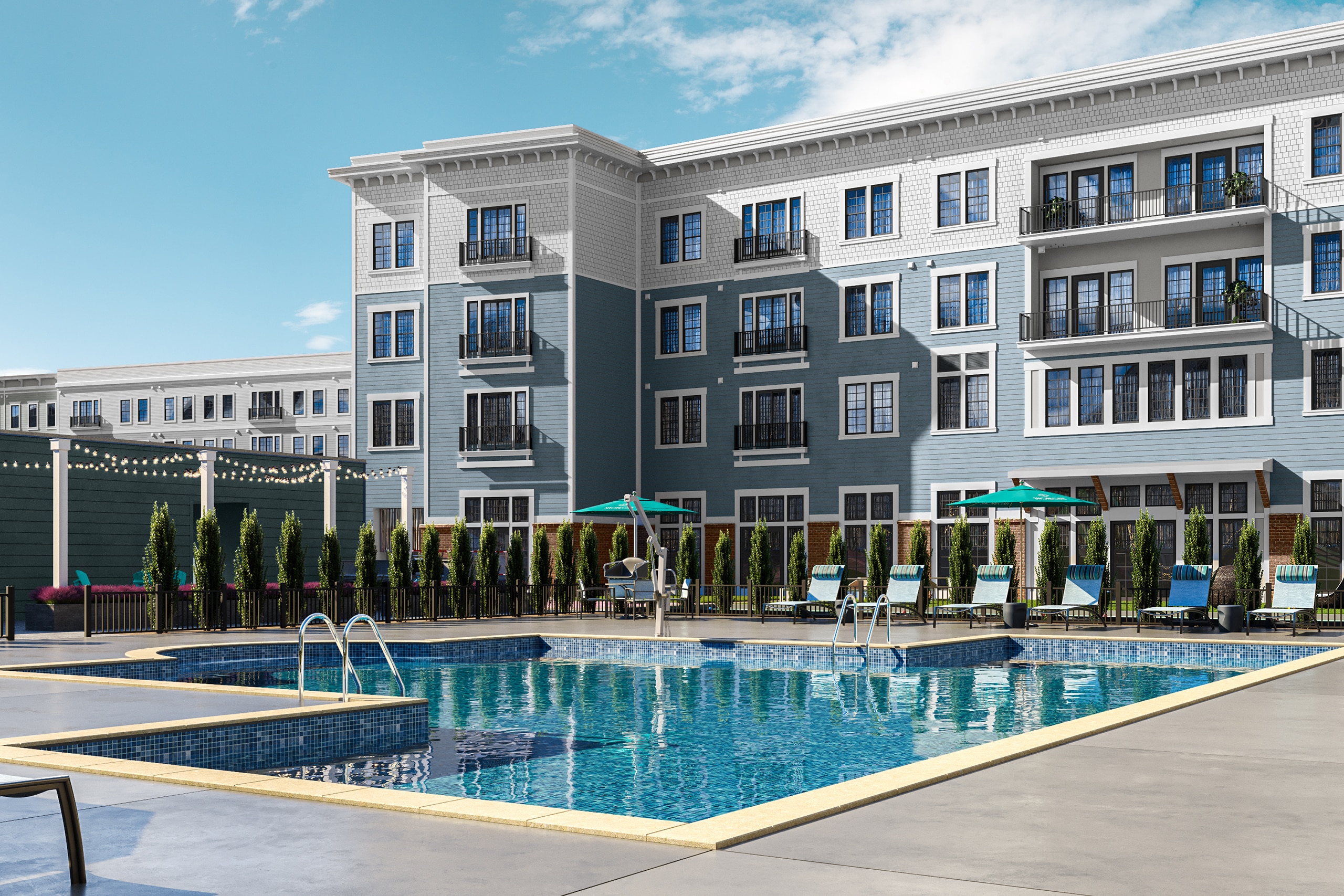 In the foreground is an inground pool facility, in the background is a four story tall building, blue-grey and white, with windows and balconies.